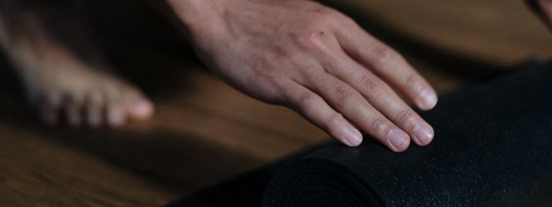 Close up of a yoga mat texture in dark room.